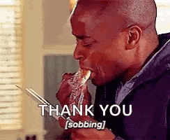 a man is eating a piece of food with chopsticks and a thank you sobbing .