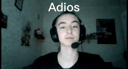 a young man wearing headphones and a microphone with the word adios behind him