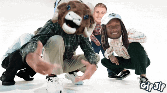 a group of people posing for a photo with a gif gif written on the bottom