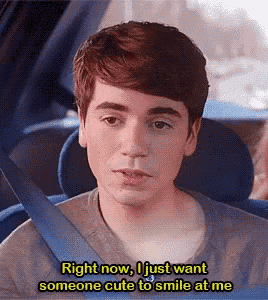 a young man in a car with the words right now i just want someone cute to smile at me above him