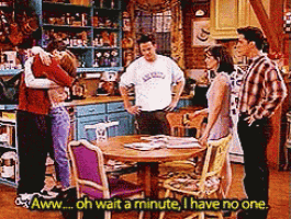 a group of people standing around a table with the words " oh wait a minute i have no one "