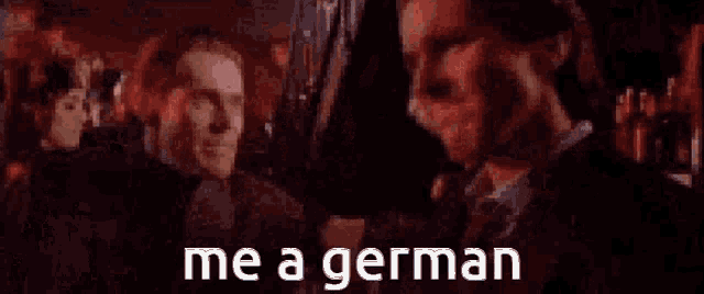 a man in a suit and tie is talking to another man with the words me a german on the bottom