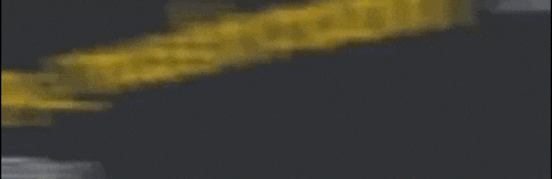 a blurred image of a yellow ribbon on a dark background