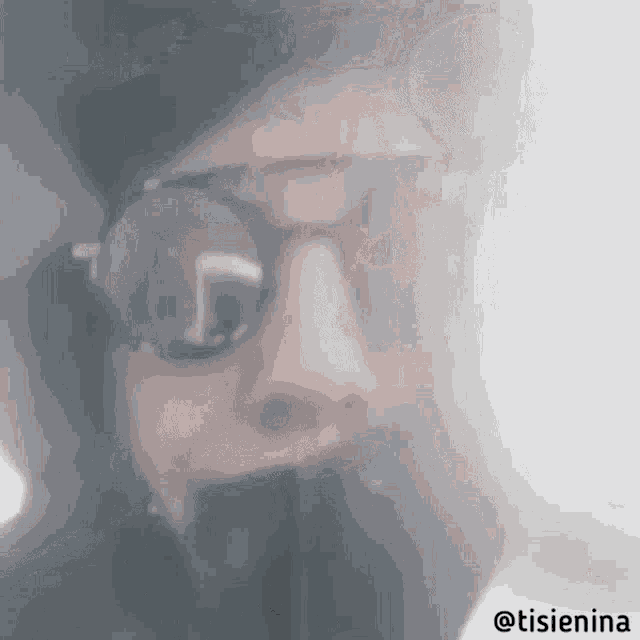 a close up of a man 's face with glasses and a beard with the hashtag @tisienia