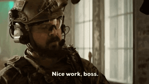a man in a helmet and goggles says " nice work boss "