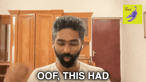 a man with a beard and headphones says oof this had