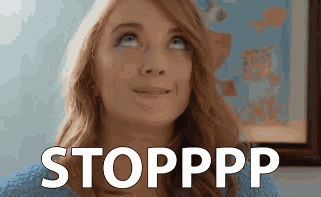 a woman is making a funny face and looking up at the sky with the words stopppp written on her face .