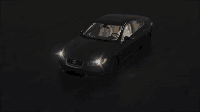 a black car with the word jaguar on the side