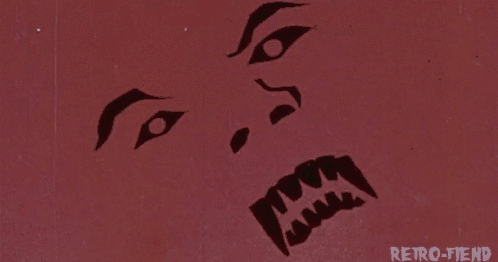a close up of a werewolf 's face with teeth .