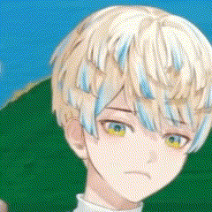 a close up of a person 's face with blonde hair and blue streaks on it .