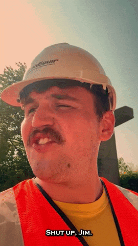 a man wearing a hard hat and an orange vest is saying shut up jim
