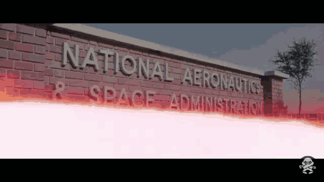 a brick wall with the words national aeronautics space administration written on it