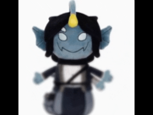 a stuffed toy with a horn on its head
