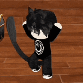a doll is standing on a wooden floor wearing a black shirt with a white g on it .