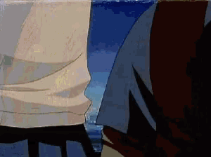 a couple of people standing next to each other on the beach