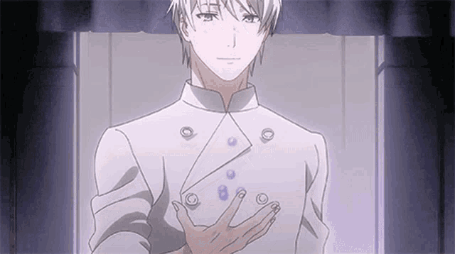 a man in a white jacket is holding something in his hand