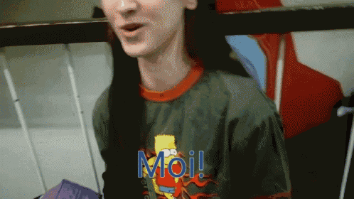 a person wearing a green shirt with bart simpson on it says moi
