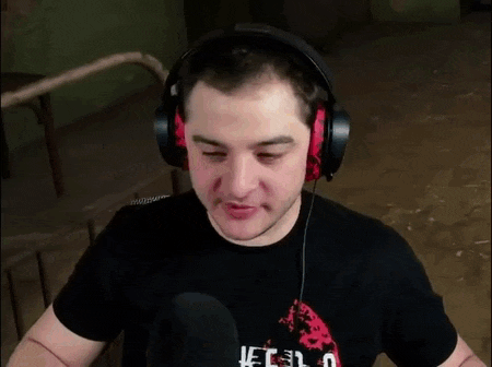 a man wearing headphones is talking into a microphone and saying `` got you '' .