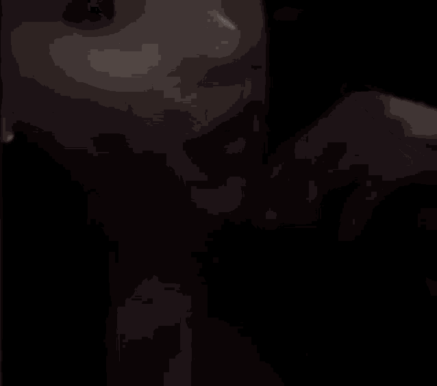 a close up of a woman 's face with her mouth open .
