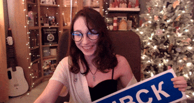 a woman holding a sign that says rock