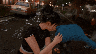a woman in a black top is holding a man 's arm in a video game