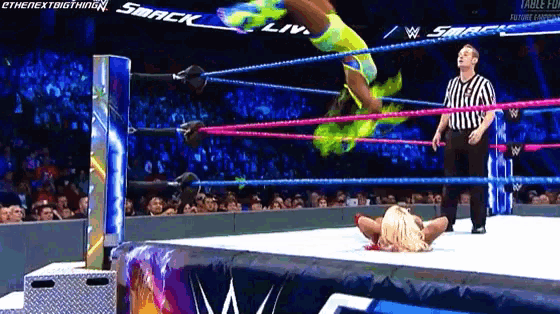 a woman in a wrestling ring with the word smack on the back