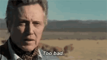 a man is standing in the middle of a desert and saying too bad .