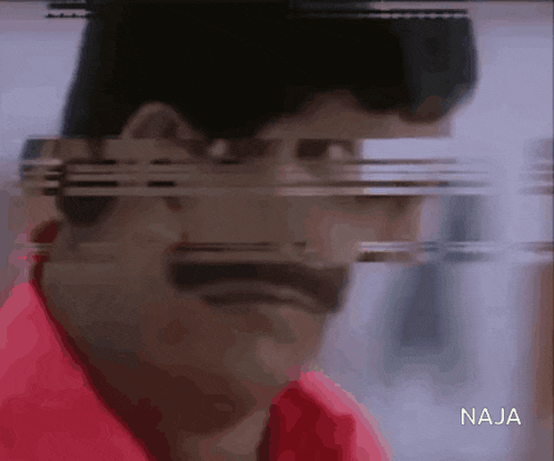 a close up of a man 's face with a mustache and the word naja on the bottom
