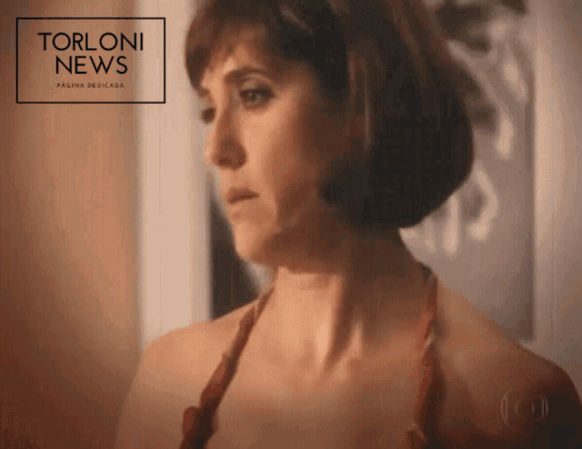a woman in a red dress is featured in a torloni news advertisement