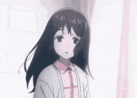 a girl with long black hair is wearing a pink shirt and cardigan .