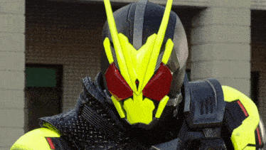 a close up of a person wearing a black and yellow helmet with red eyes
