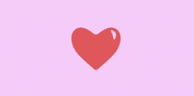a red heart on a pink background with two holes in it