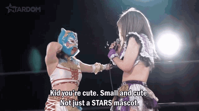 two women in a wrestling ring with the words kid you 're cute small and cute