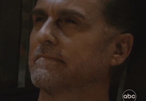 a close up of a man 's face with the abc logo on the bottom right