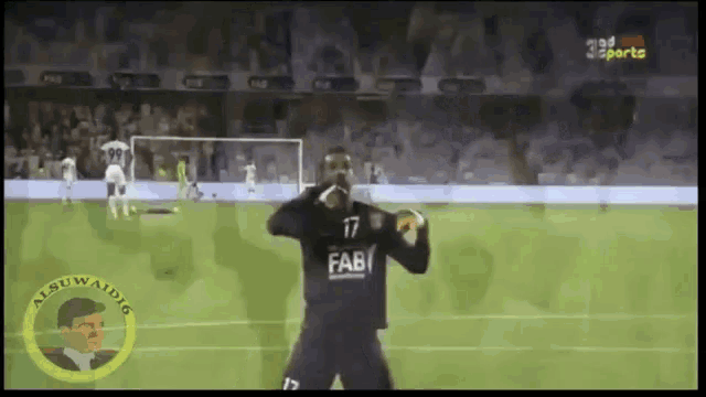 a soccer player wearing the number 17 fab jersey stands on the field