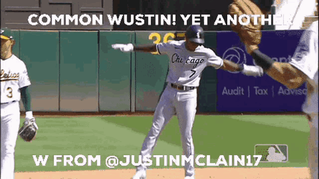 a baseball player with the number 7 on his jersey is jumping in the air