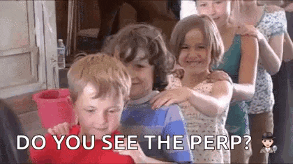 a group of children are standing in a line with their arms around each other and smiling .