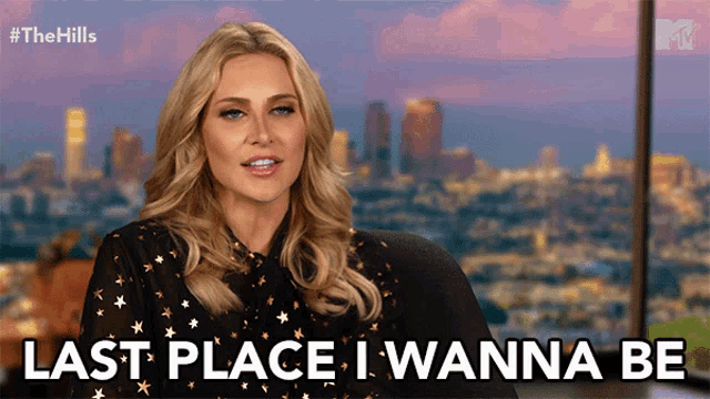a woman says " last place i wanna be " in front of a city