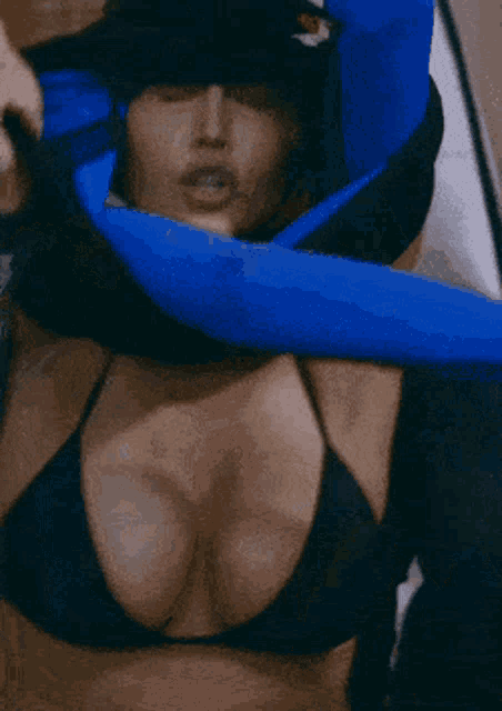 a woman 's breasts are being held by a man