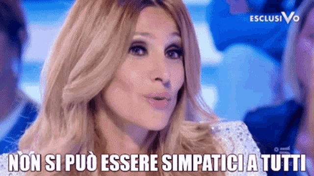 a woman is making a funny face and says non si puo essere simpatica tutti .