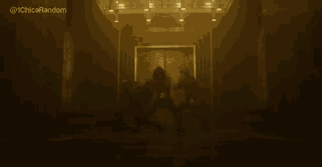 a group of people are standing in a dark room with a sign that says ' chico random ' on it .