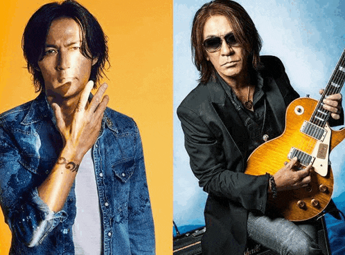 a man in a denim shirt holds a guitar next to another man