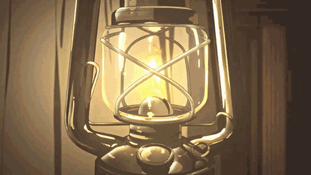 a close up of a lantern with a flame coming out of it