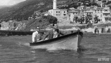 two men in a boat with the word netflix on the bottom right