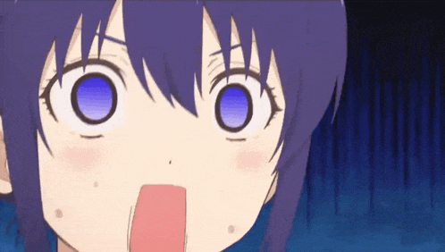 a close up of a girl 's face with a surprised expression
