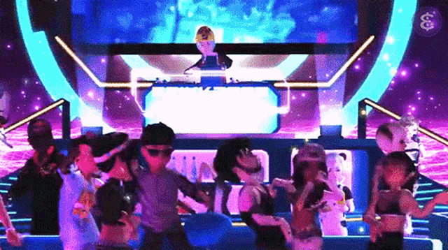 a group of people are dancing in front of a dj in a club .