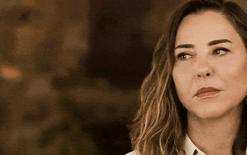 a close up of a woman 's face with her eyes closed