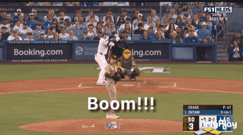 a baseball player swings at a pitch and the word boom is displayed on the screen