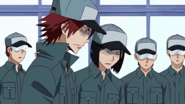 a group of people wearing hats and goggles standing in a line