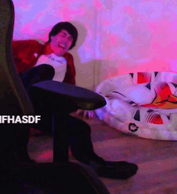 a man is sitting in a chair with his foot on a table with the hashtag ifhasdf on the bottom